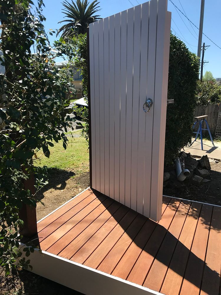 A White Wooden Gate Is Open to A Wooden Deck — Tradewind Building Maintenance in Bulli,NSW