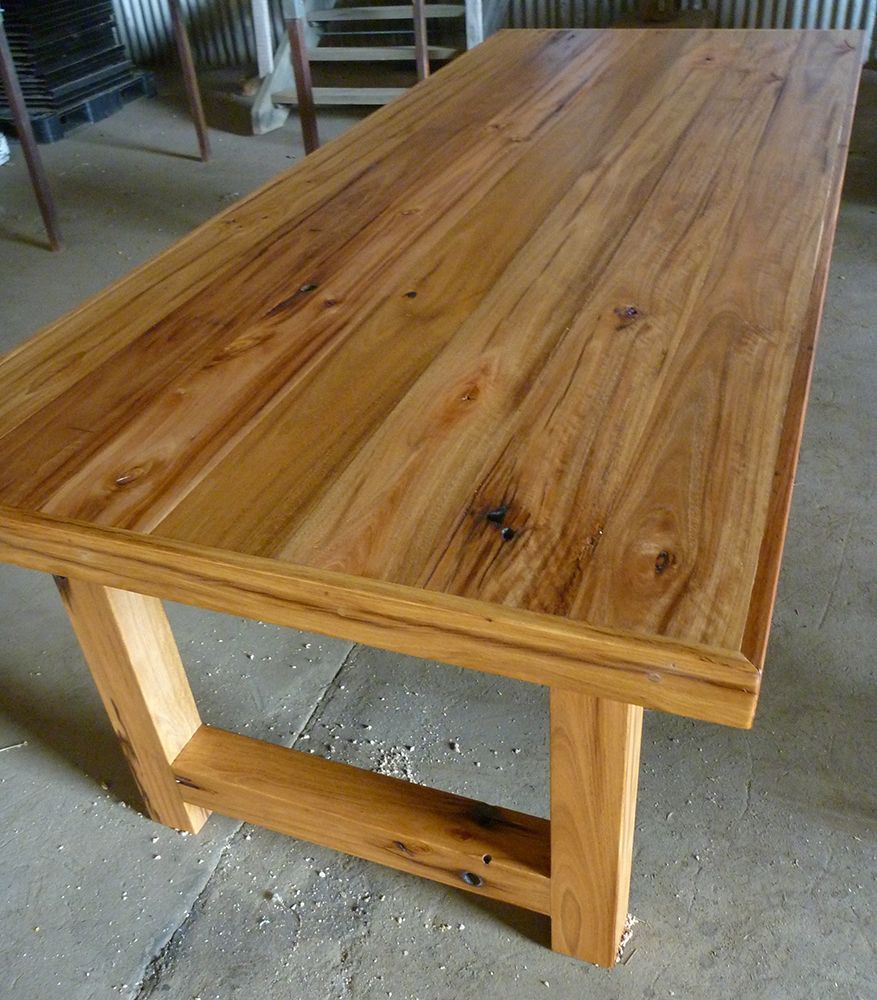A Wooden Table Is Kept on A Concrete Floor — Tradewind Building Maintenance in Bulli,NSW