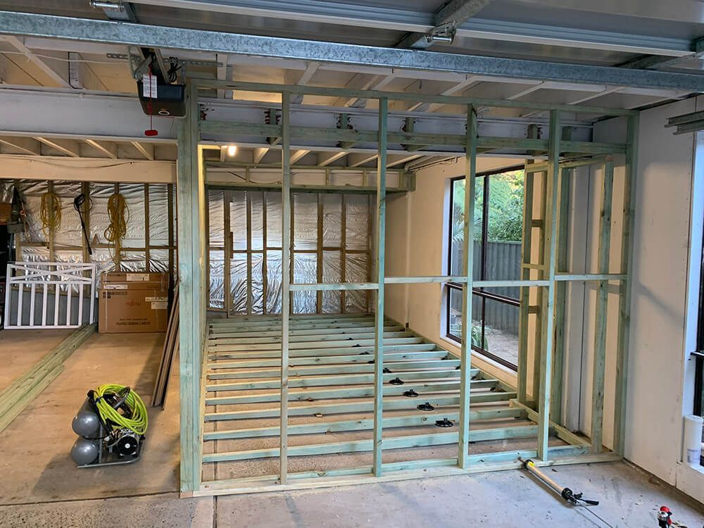 A Room with A Lot of Wooden Frames in It For Renovation — Tradewind Building Maintenance in Woonona,NSW