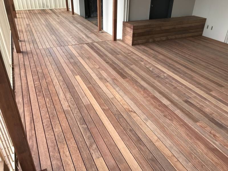 A Wooden Bridge with Stairs Leading up To It in A Garden — Tradewind Building Maintenance in Woonona,NSW