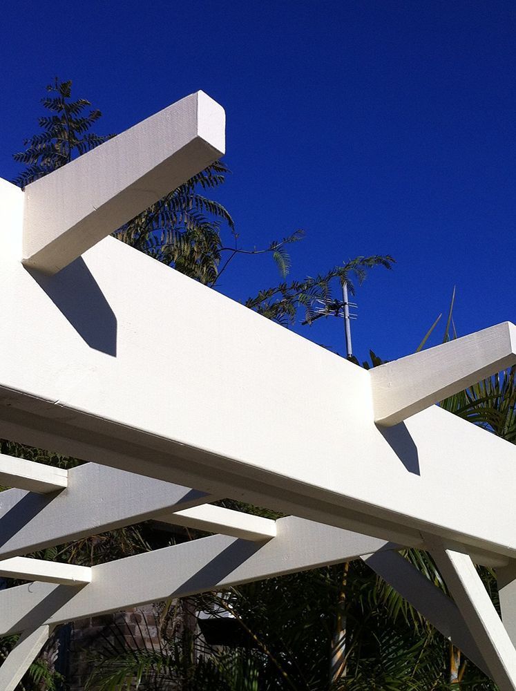 A White Pergola with A Blue Sky in The Background — Tradewind Building Maintenance in Austinmer,NSW