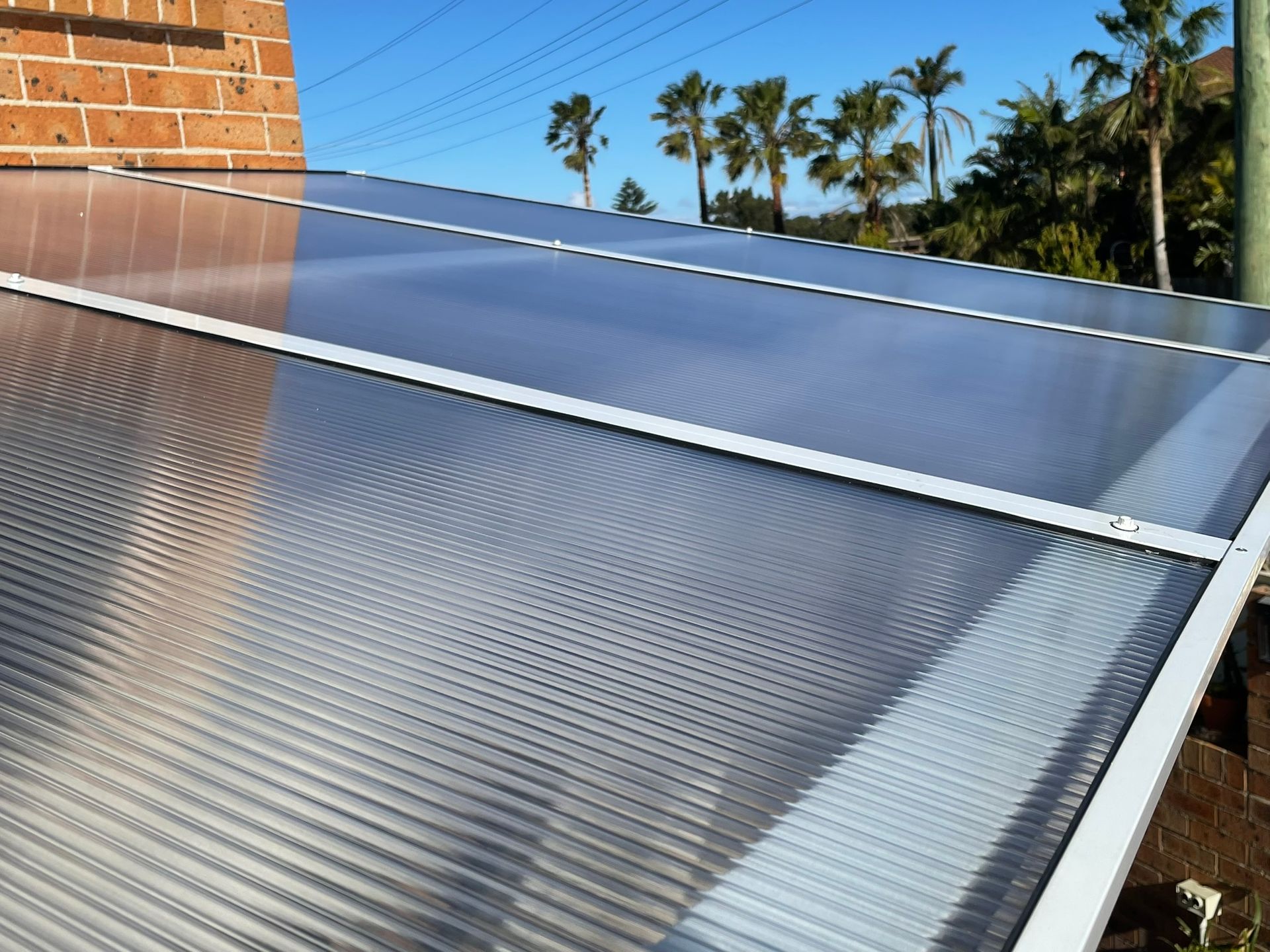 A White Closet with Shelves and A Hanger in A Room — Tradewind Building Maintenance in Woonona,NSW