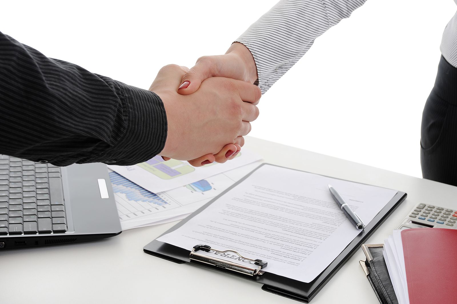 Shaking hands after signing a legal document