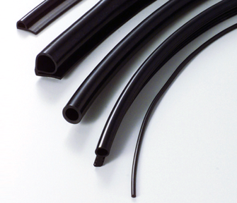 A bunch of black rubber tubes on a white surface