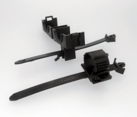 A pair of black cable ties on a white surface