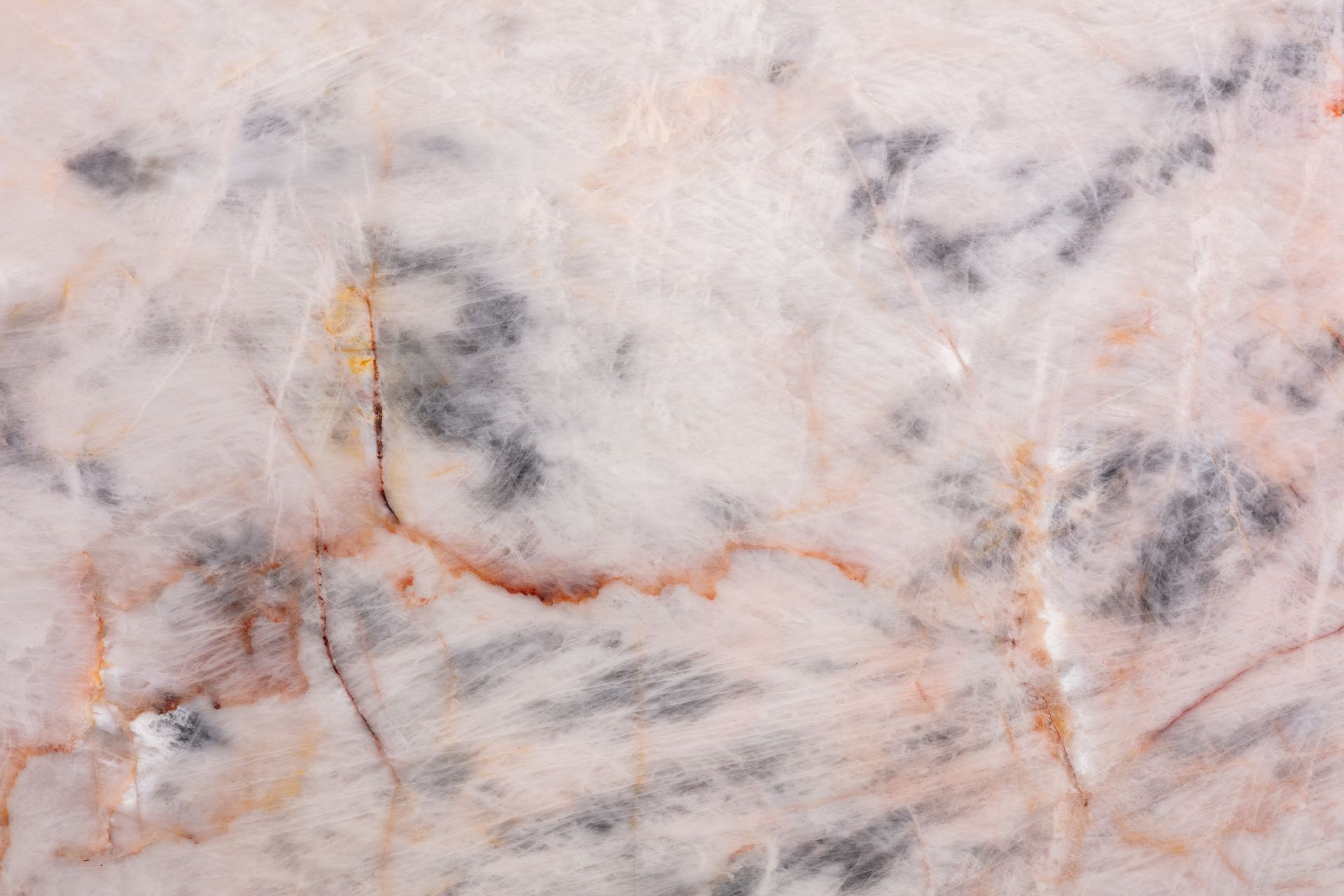 White marble surface with grey and brown veining.