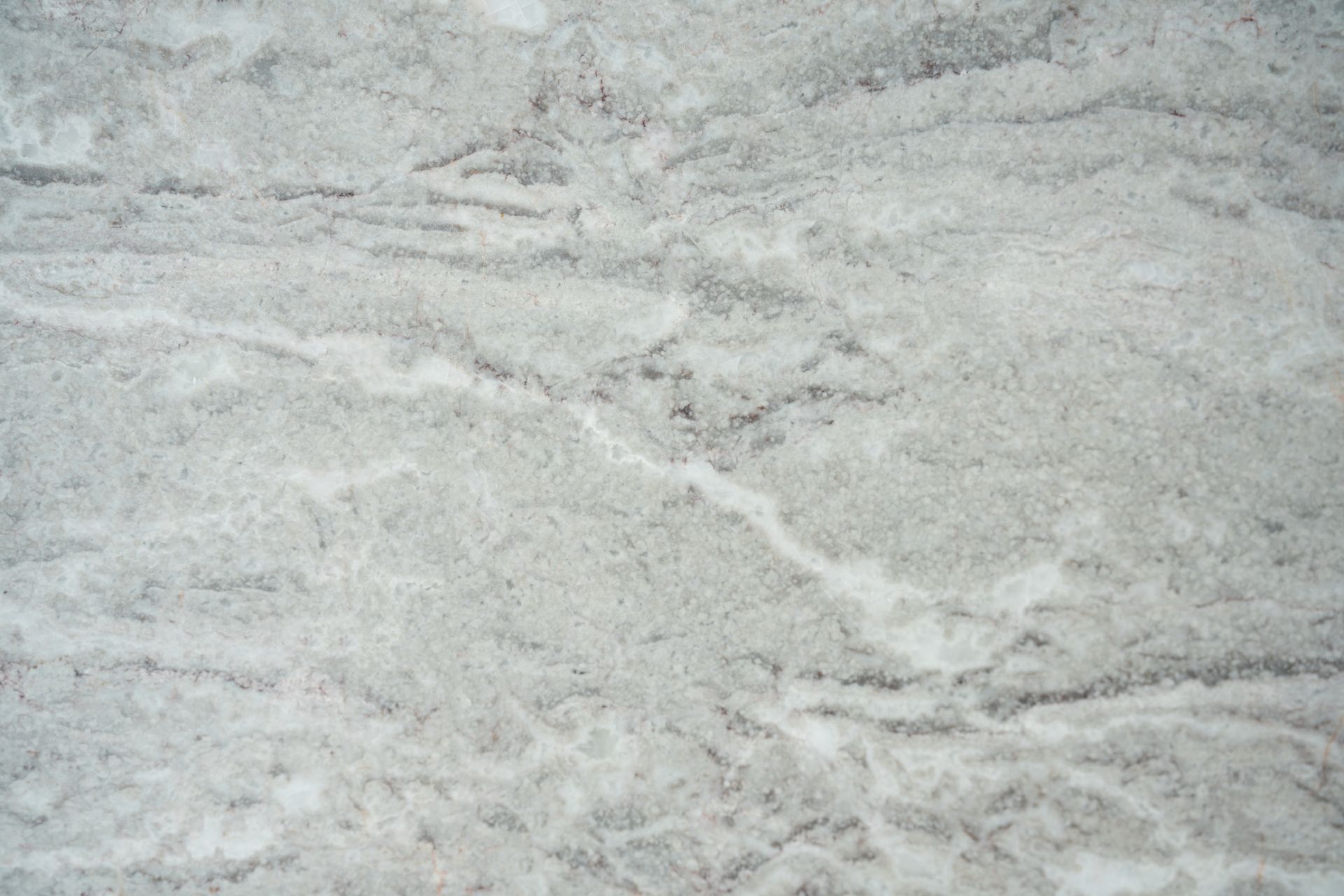 Gray and white marble surface with dark veining.