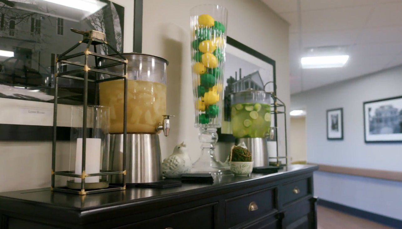 A buffet table with a variety of drinks on it