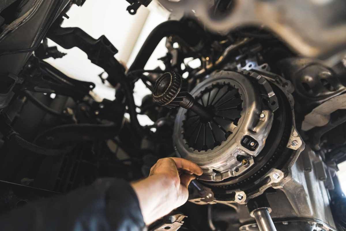 Mechanic working on a car’s transmission near Sharonville, Ohio (OH)