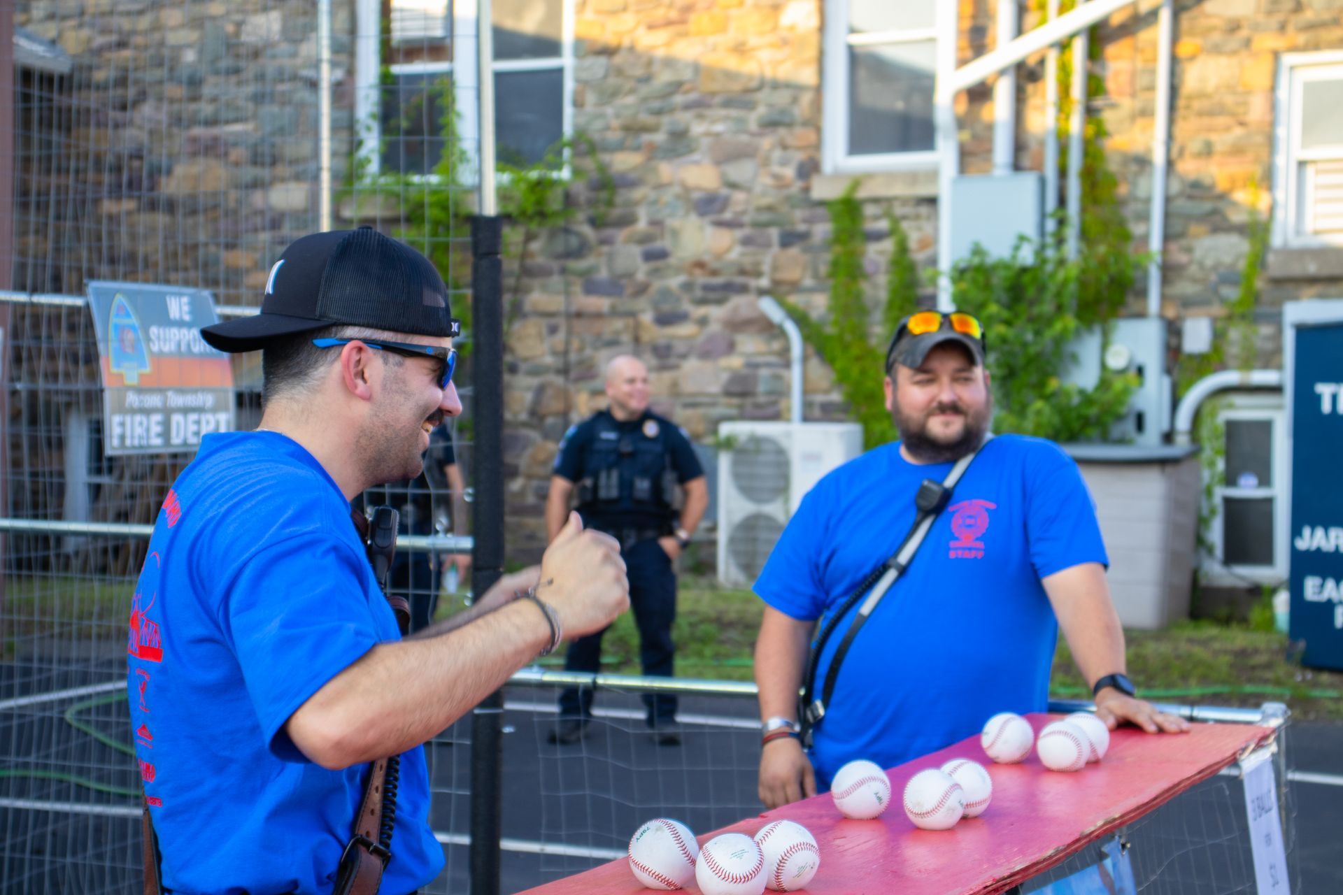 Two firemen working the Dunk Tank at Carnival