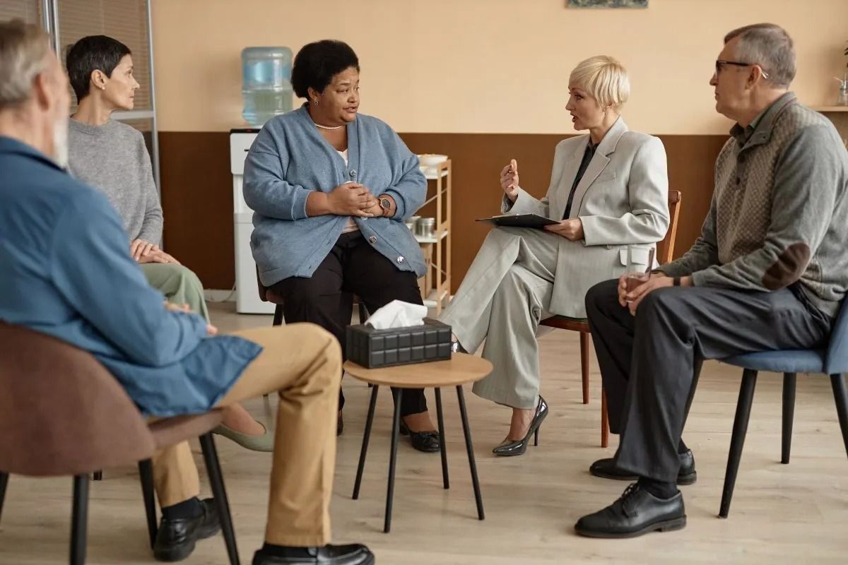 group of people talking in a semi-circle