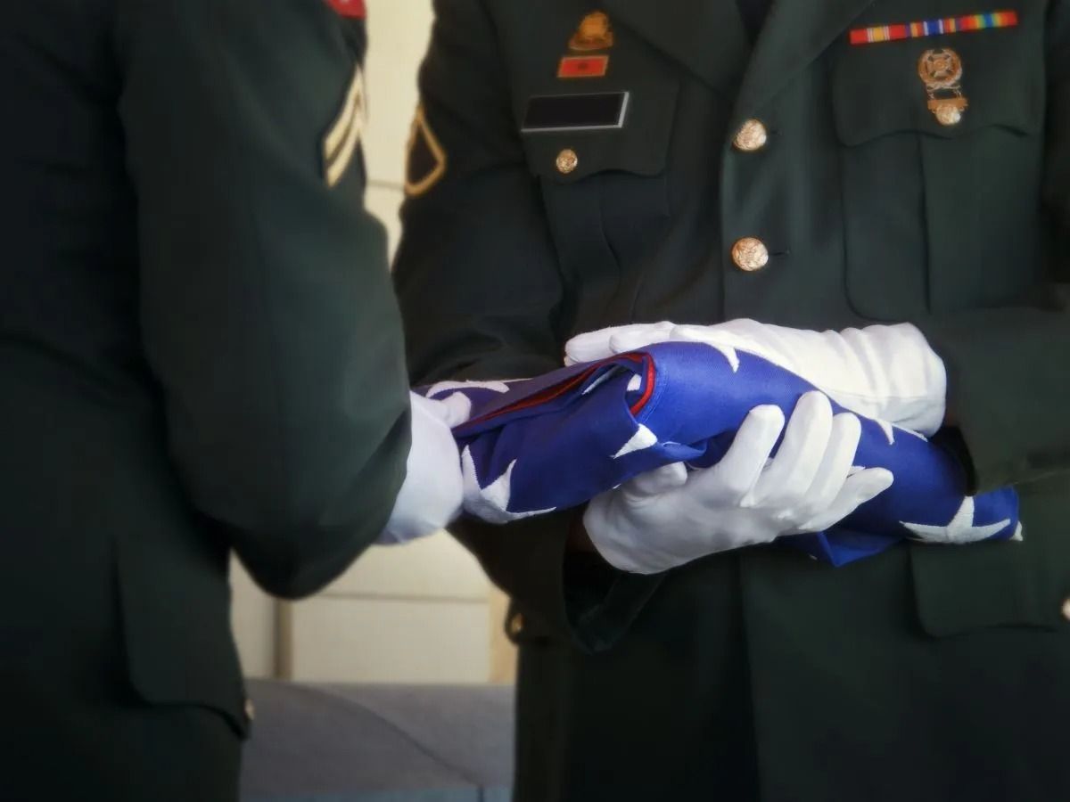 Soldiers Folding An American Flag