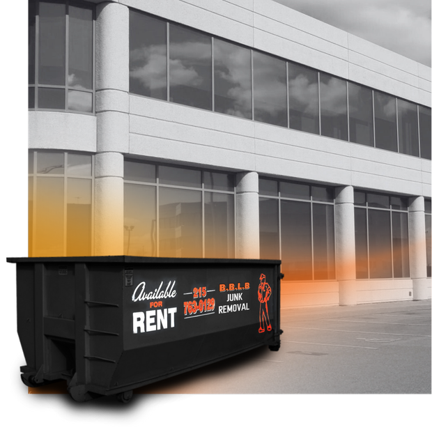 a 20 cubic yard BBLB Dumpster in front of a building