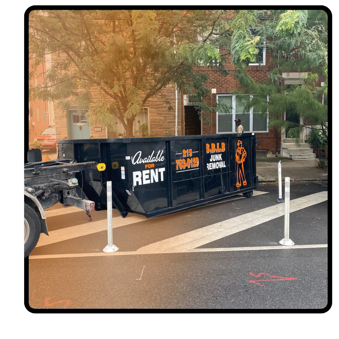 An image of BBLB dumpster in front an apartment