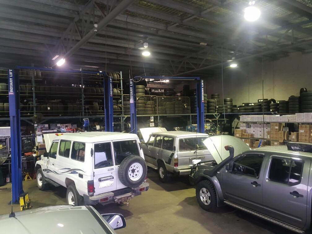 A Bunch Of Cars Are Parked In A Garage — Torque Tyres & Trailer Spares Mackay in Mackay, QLD