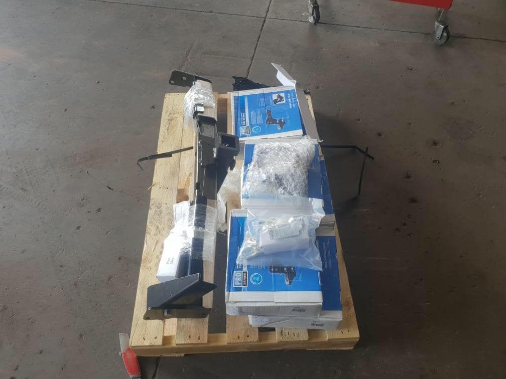 A Wooden Pallet With Boxes On Top Of It — Torque Tyres & Trailer Spares Mackay in Mackay, QLD