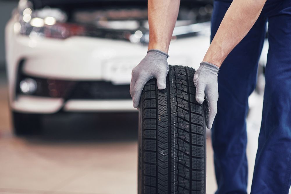 Mechanic Holding A Quality Tyre