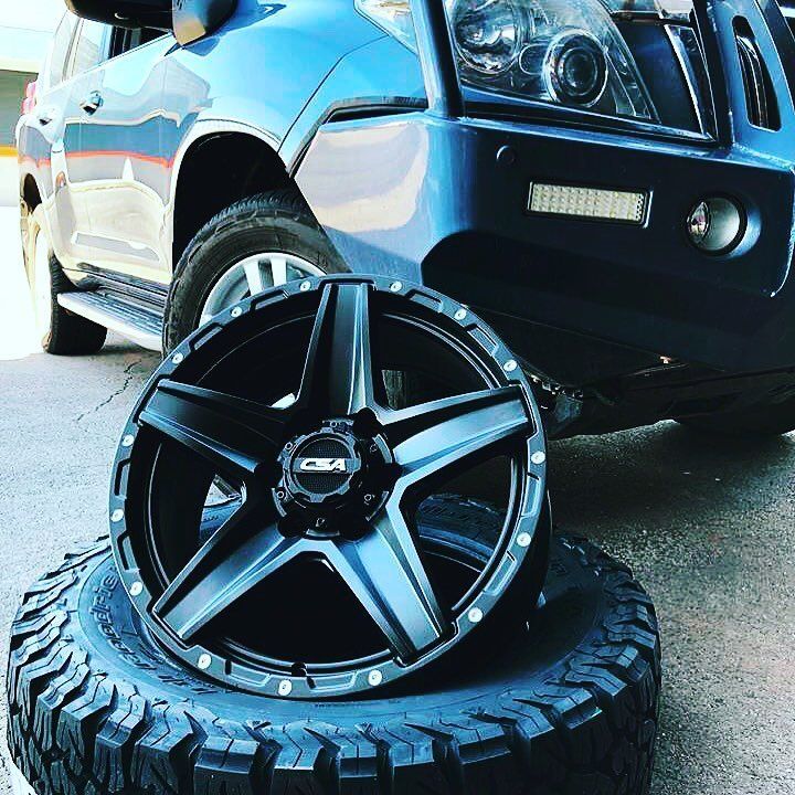 A Car With A Tire And A Wheel On It