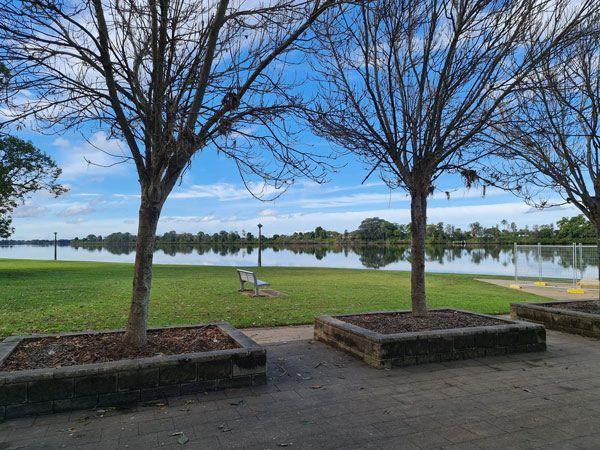 The Sun is Setting Behind a Large Rock in the Desert — PH Power in Wauchope, NSW