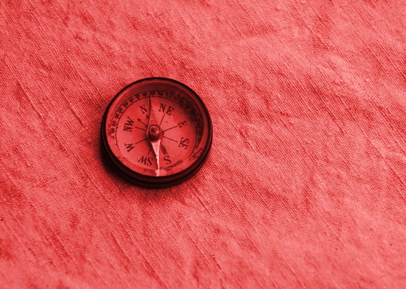 Compass on red