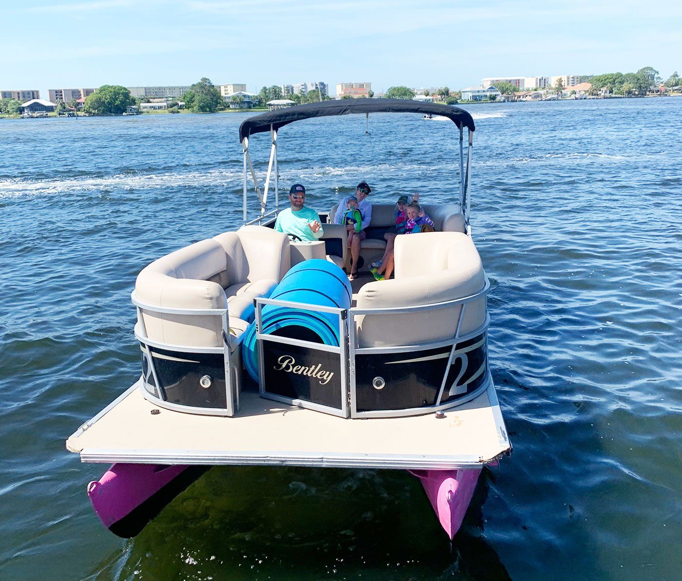 Family in pink pontoon boat rental in Destin FL