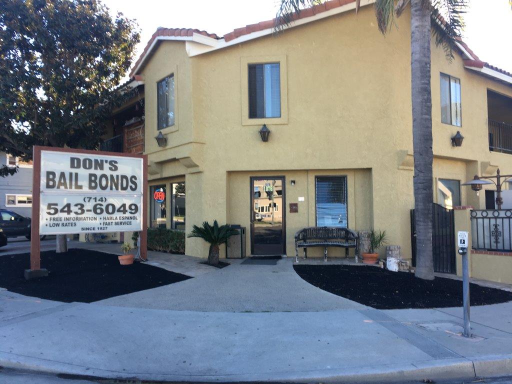 Don's Bail Bonds building with sign, phone number, and landscaping.