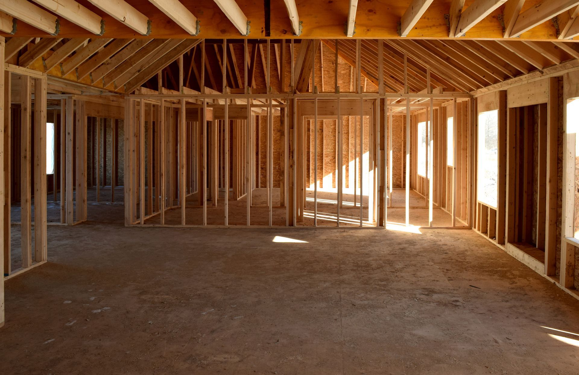 A room with a roof and beams done by Amish Builders