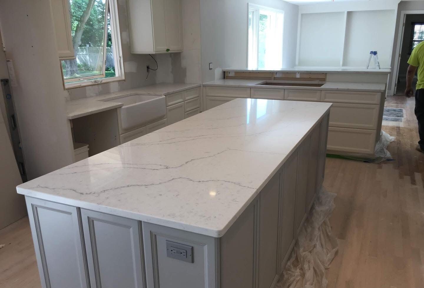 There is a large island in the middle of the kitchen.