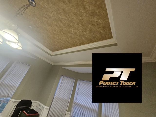 A room with a perfect touch logo on the wall