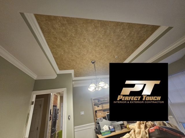 A room with a ceiling that has a perfect touch logo on it