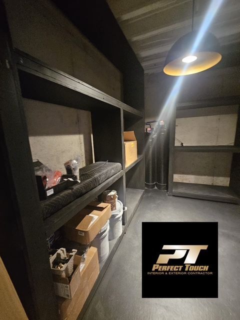 A room with shelves and a perfect touch logo