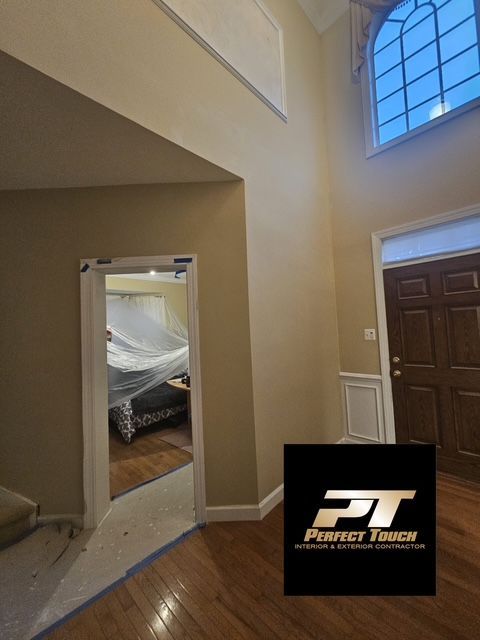 A picture of a room with a perfect touch logo