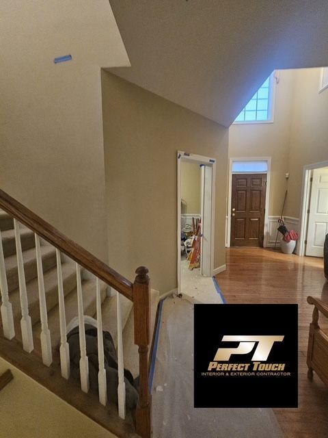 A picture of a staircase with a perfect touch logo