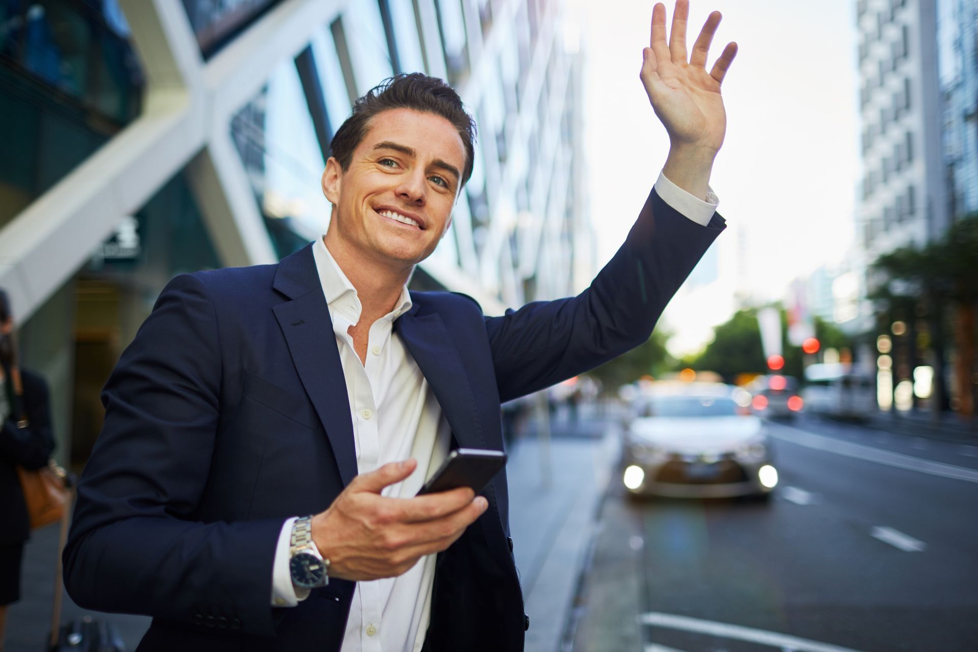 Man Holding a Mobile Phone — Sale, VIC — Sale City Taxis