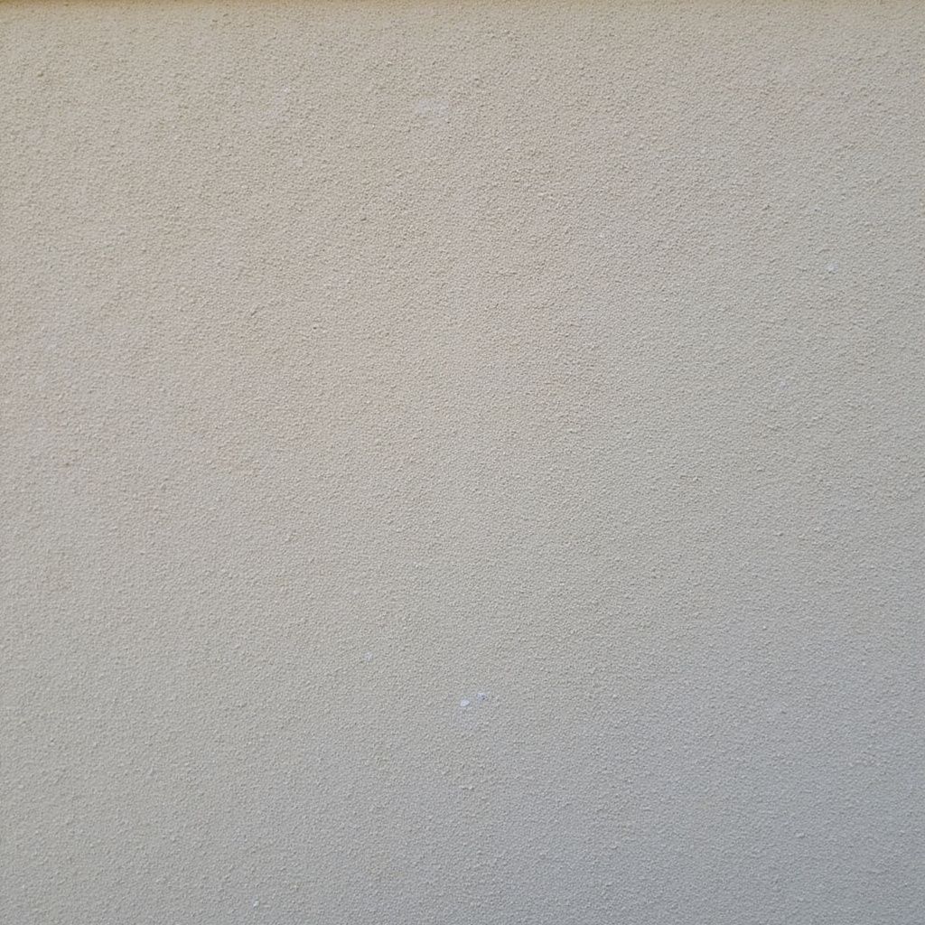 Textured light gray surface.