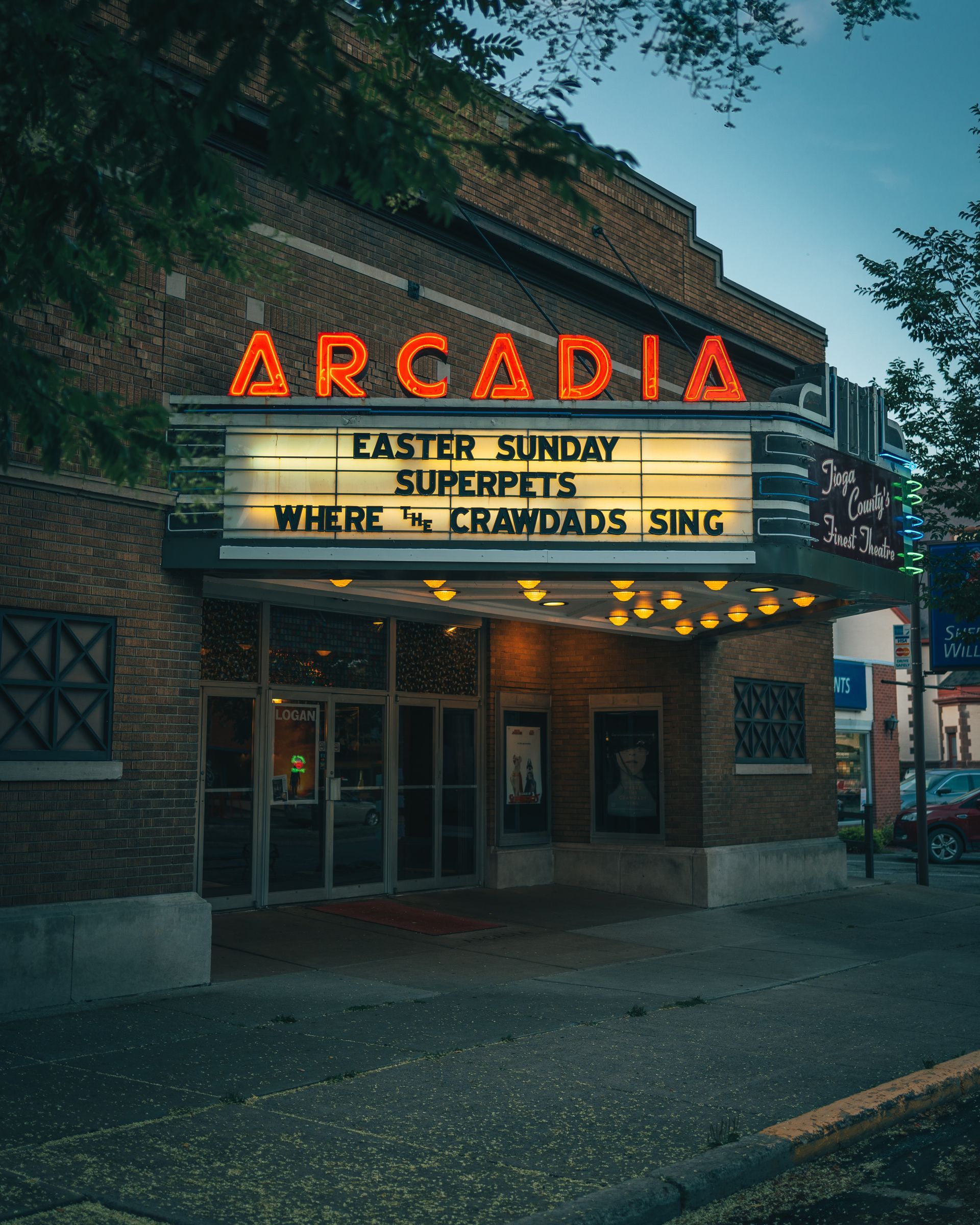 A brick building with a sign that says ' arcadia ' on it