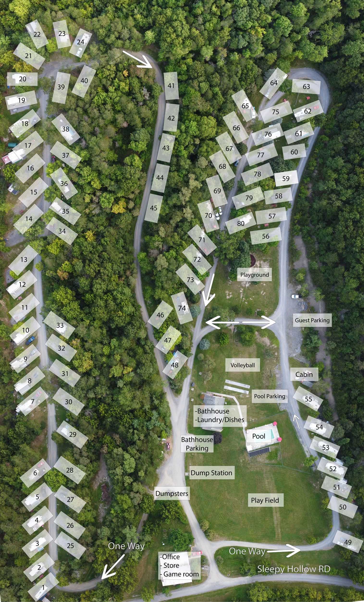 An aerial view of a campground surrounded by trees and grass.
