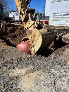 A bulldozer is digging a hole in the ground.
