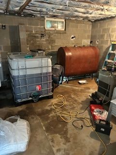 There is a large tank in the middle of the room.