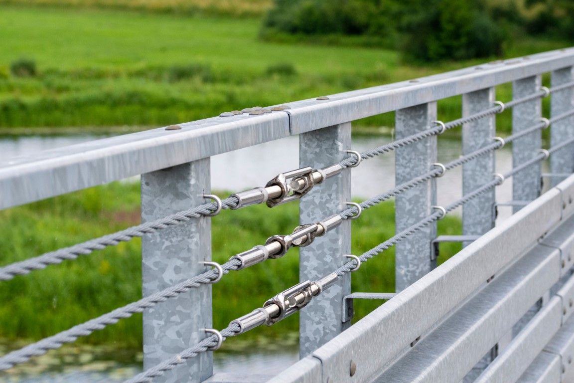 Sahuarita metal bridge railing with horizontal steel cables and turnbuckles
