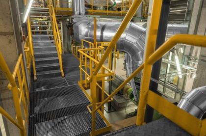 Yellow metal stairs and walkways in an industrial setting