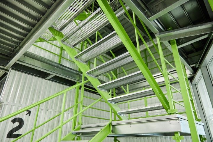 Green metal staircase inside an Oro Valley  building