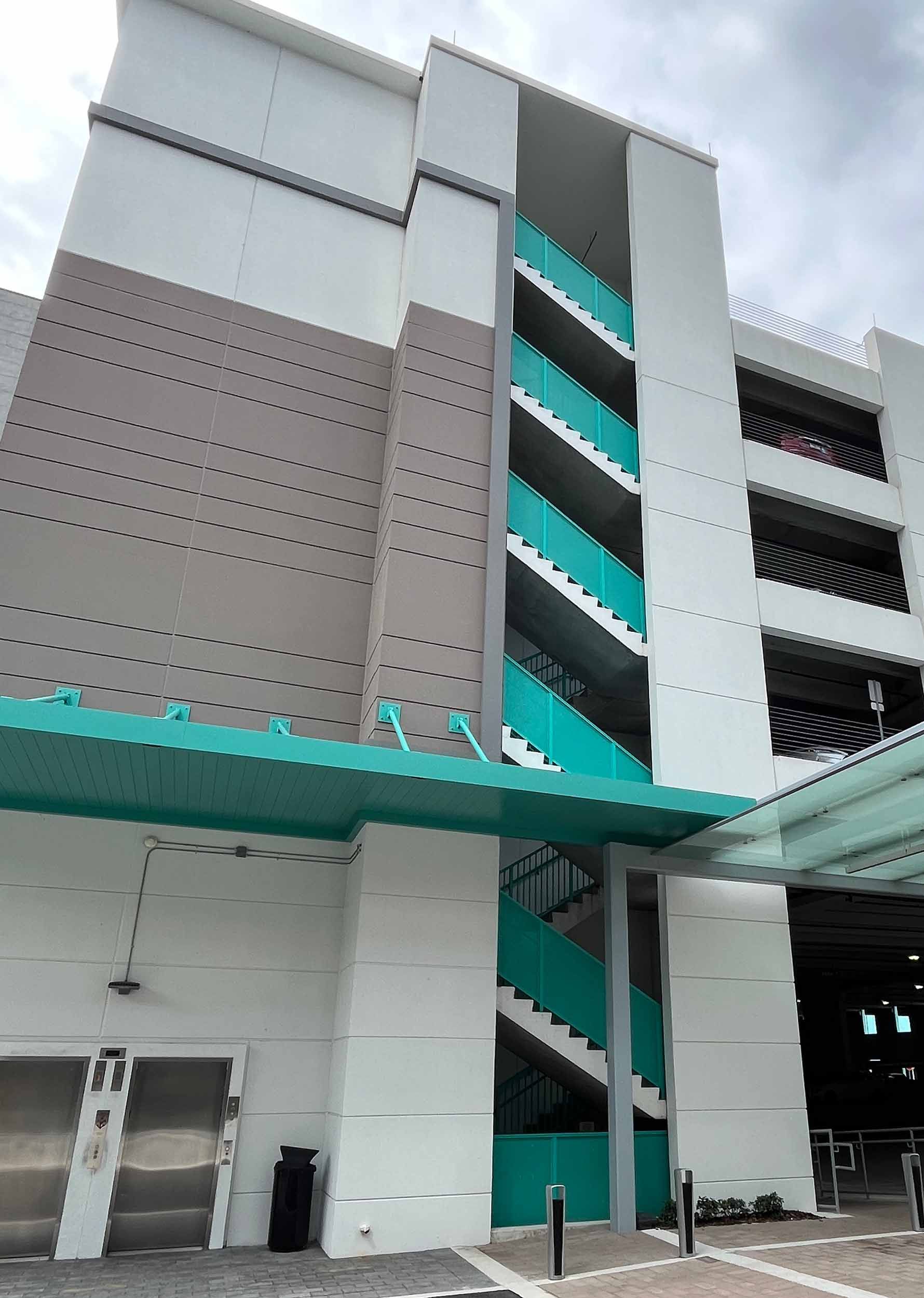 Multi-story Marana building with exterior stairs and awning