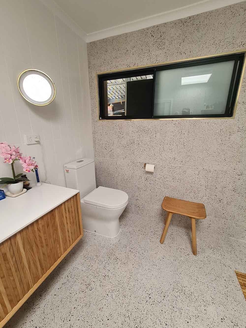 Toilet and Wooden Cabinet — Licensed Builders in Rockhampton, QLD