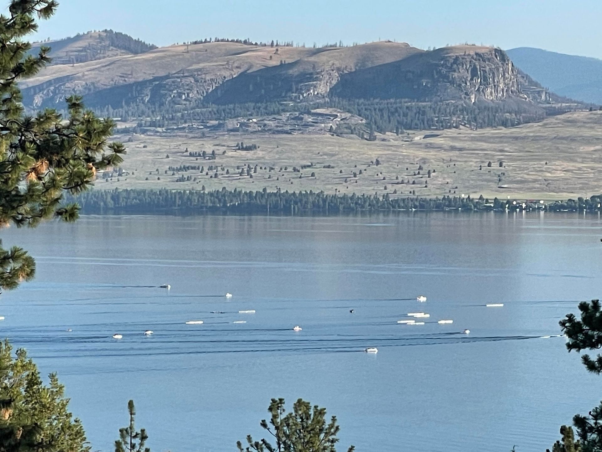 A large body of water with mountains in the background
