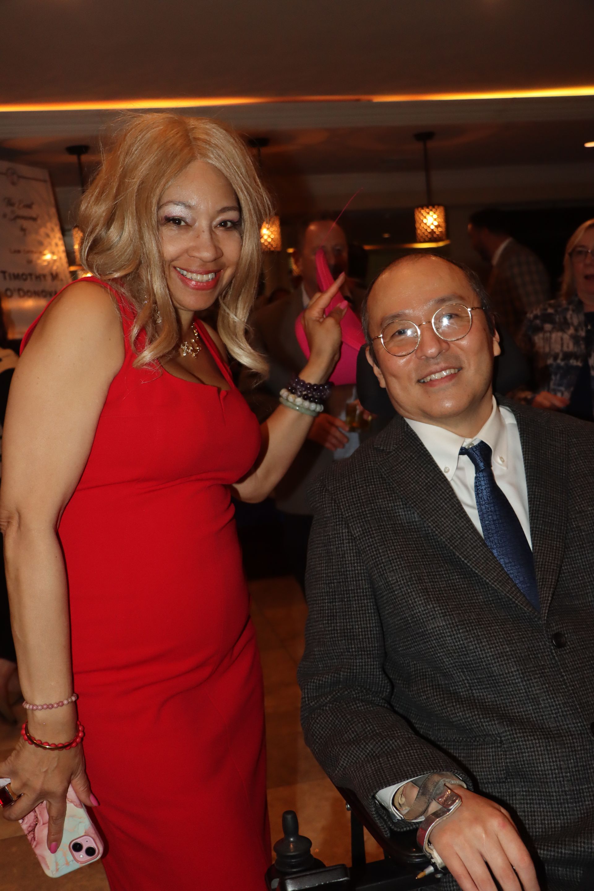 A Woman In A Red Dress Is Standing Next To A Man In A Suit And Tie — Staten Island, NY — RCBA