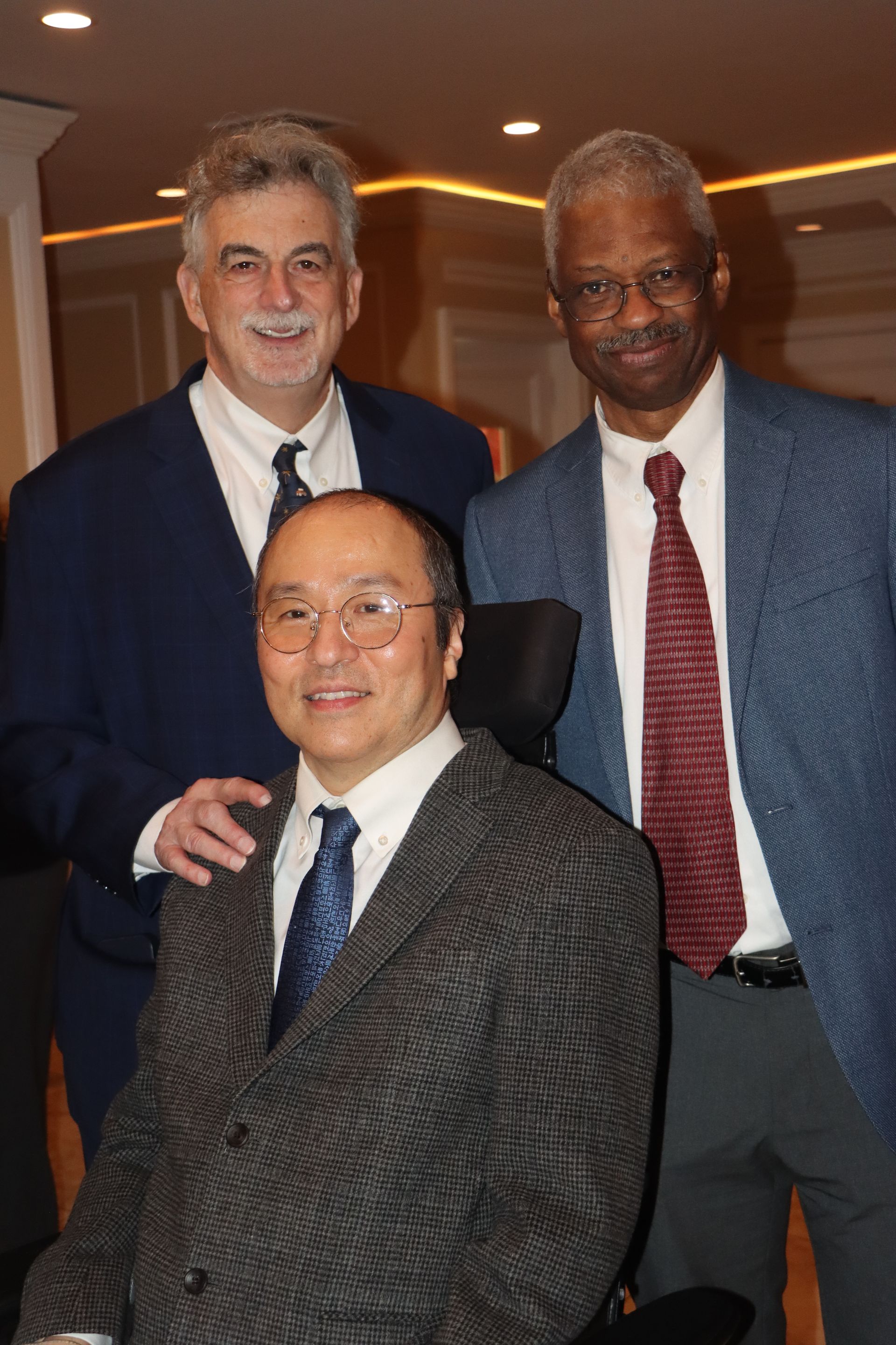 Posing For A Photo Are Three Men Dressed In Suits And Ties — Staten Island, NY — RCBA