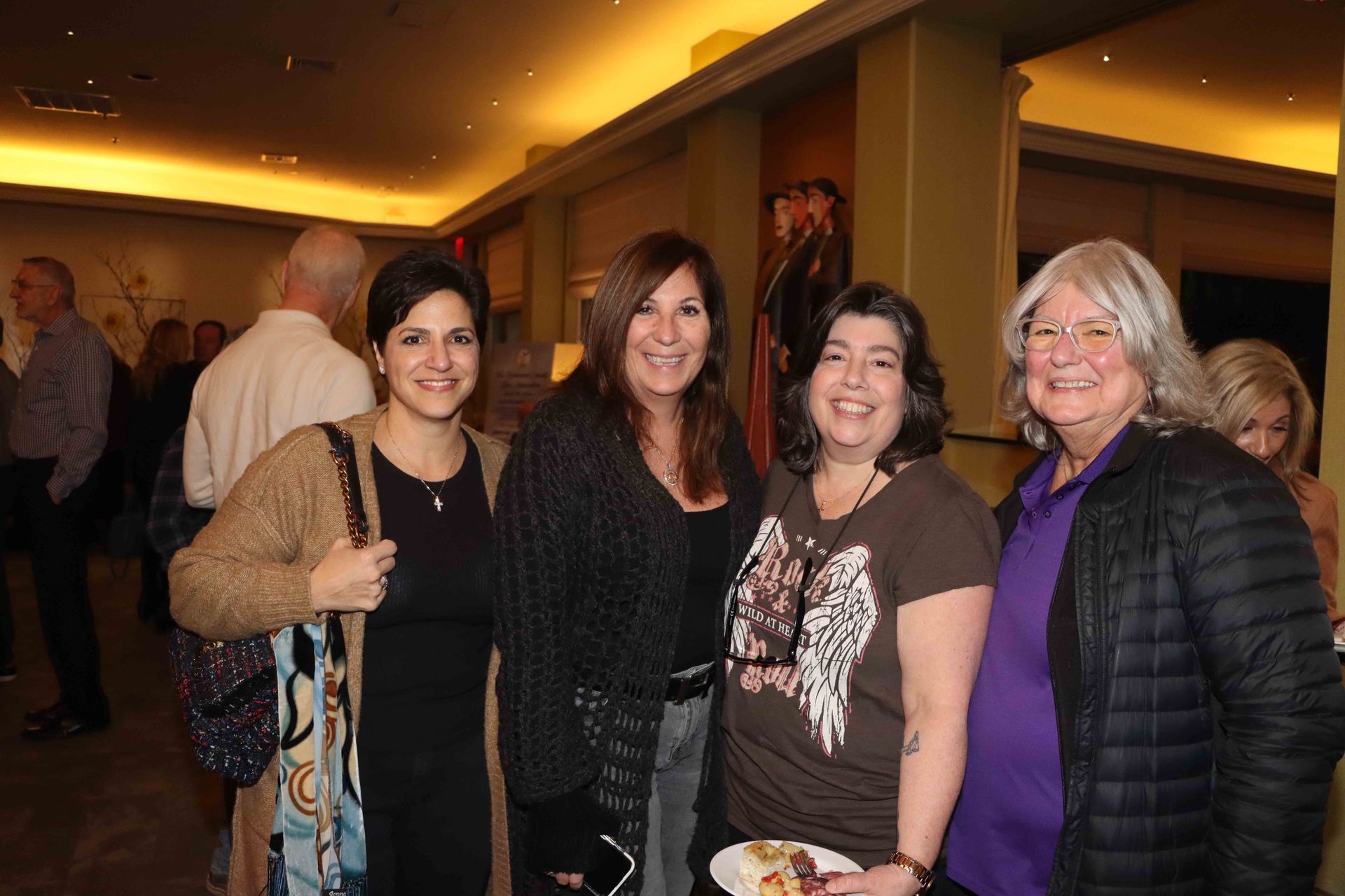 A Group Of Women Are Posing For A Picture In A Room | Staten Island, NY | RCBA