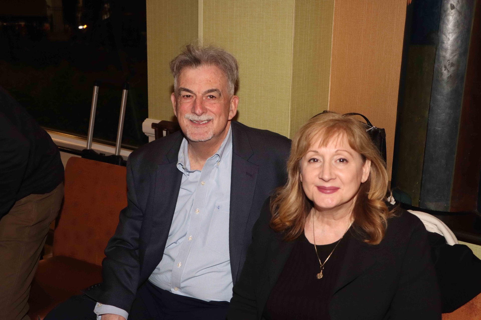 A Man And A Woman Are Sitting Next To Each Other On A Couch | Staten Island, NY | RCBA
