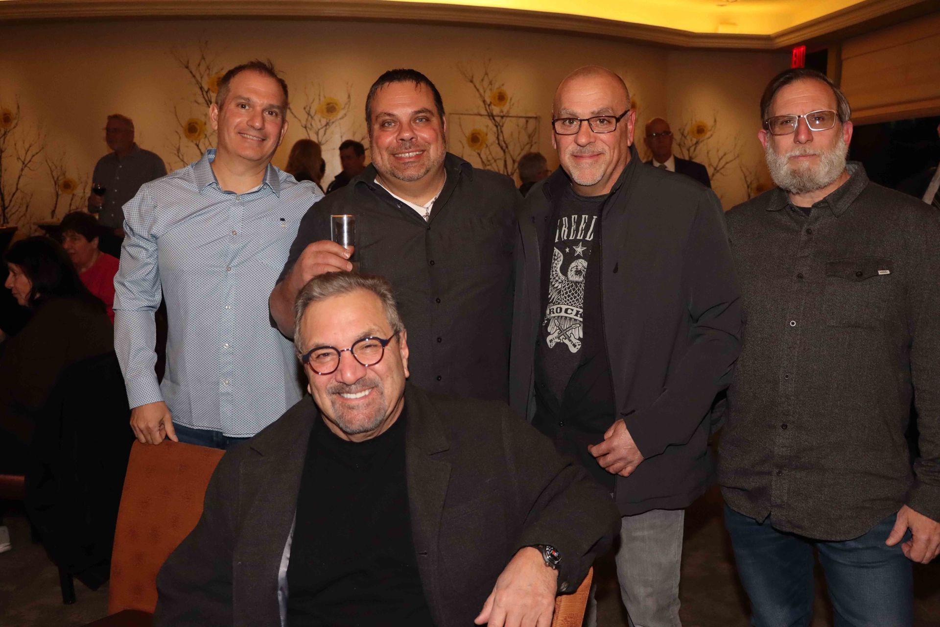 A Group Of Men Are Posing For A Picture In A Room | Staten Island, NY | RCBA
